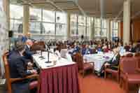 Guests listen to the speakers at Coffee & Cap Rates