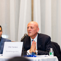 Panelists engage in a discussion moderated by Shimon Shkury at Coffee & Cap Rates, February 4, 2016