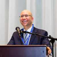 Shimon Shkury, enjoying the panel at Coffee & Cap Rates, February 4, 2016