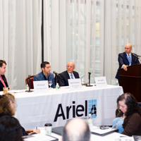 Panelists engage in a discussion moderated by Shimon Shkury at Coffee & Cap Rates, February 4, 2016