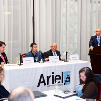 Panelists engage in a discussion moderated by Shimon Shkury at Coffee & Cap Rates, February 4, 2016