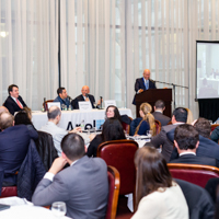 Panelists engage in a discussion moderated by Shimon Shkury at Coffee & Cap Rates, February 4, 2016