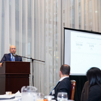 Shimon Shkury, President of Ariel Property Advisors Delivering The 2015 Year-End Market Overview Presentation at Coffee & Cap Rates, February 4, 2016