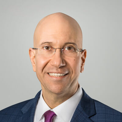 Headshot of Shimon Shkury, founder and president of Ariel Property Advisors'